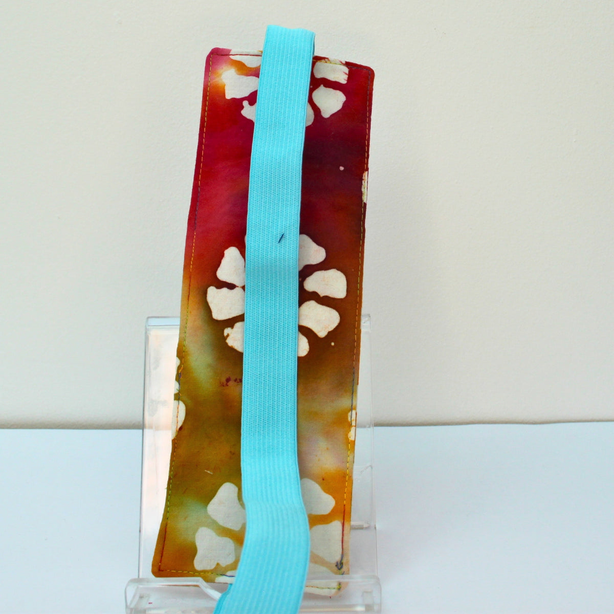 Reverse of handmade A4 fabric notebook pen pocket in Tie dye with patterns - light blue elastic— Dark Star Stitches