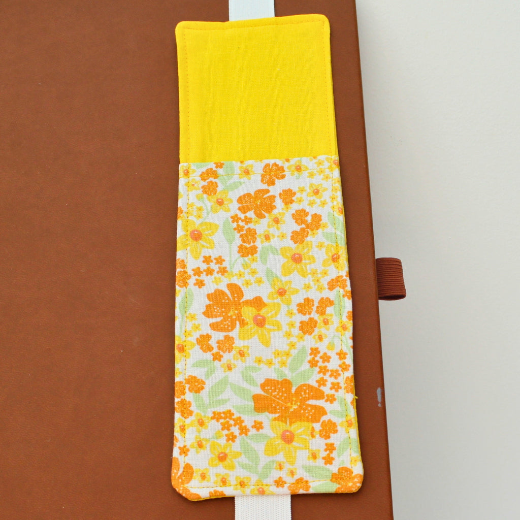 Handmade A4 fabric notebook pen pocket in Yellow and orange floral - white elastic— Dark Star Stitches. 