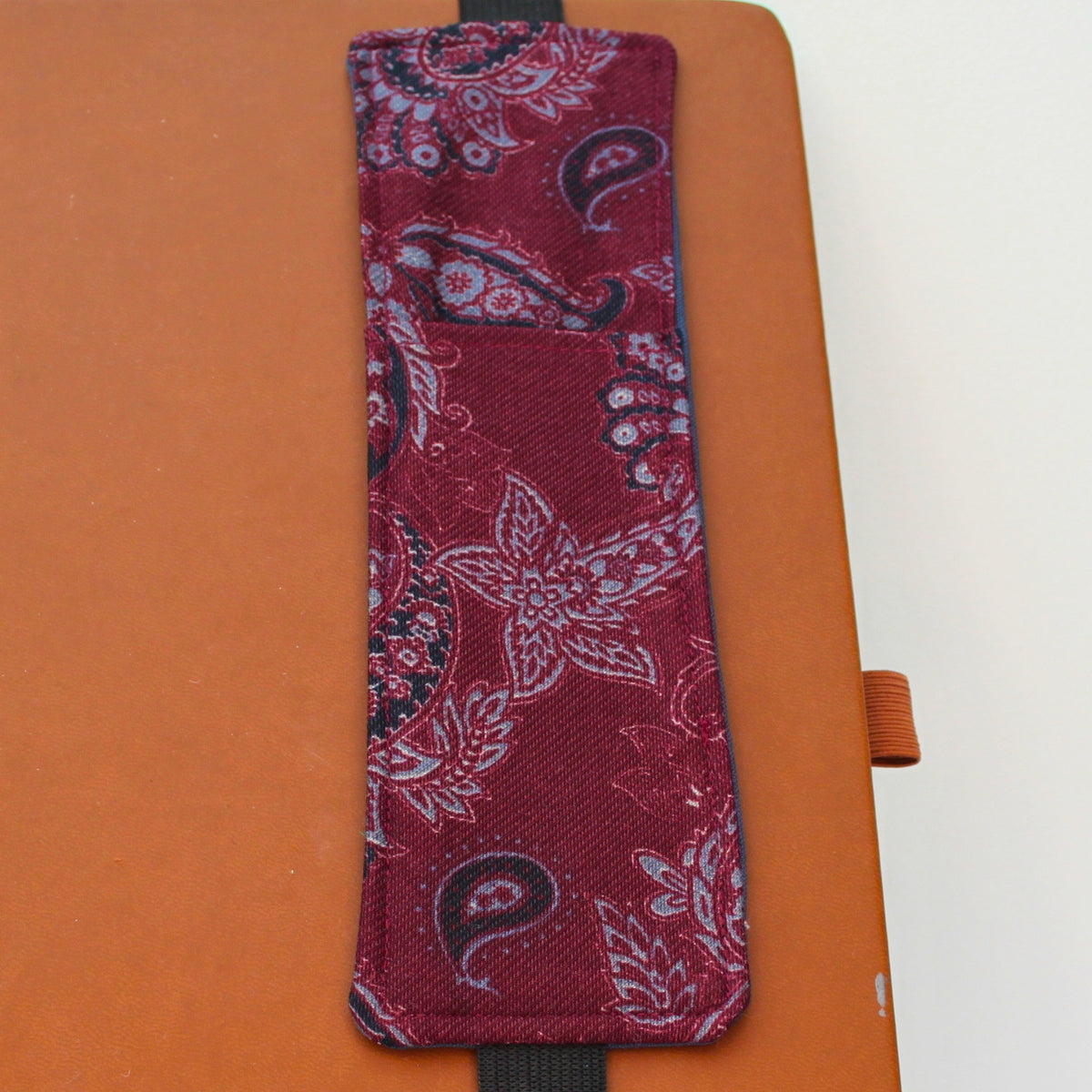 Handmade A4 fabric notebook pen pocket in [Burgundy and grey paisley - black elastic — Dark Star Stitches 