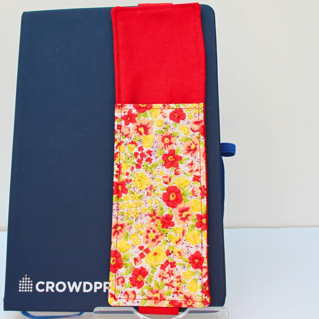Handmade A5 fabric notebook pen pocket in bright red, yellow and pink florals, red elastic — Dark Star Stitches