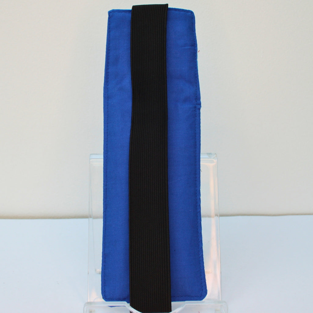 Reverse of handmade A5 fabric notebook pen pocket in blue ladybird with white dot fabric, black elastic — Dark Star Stitches