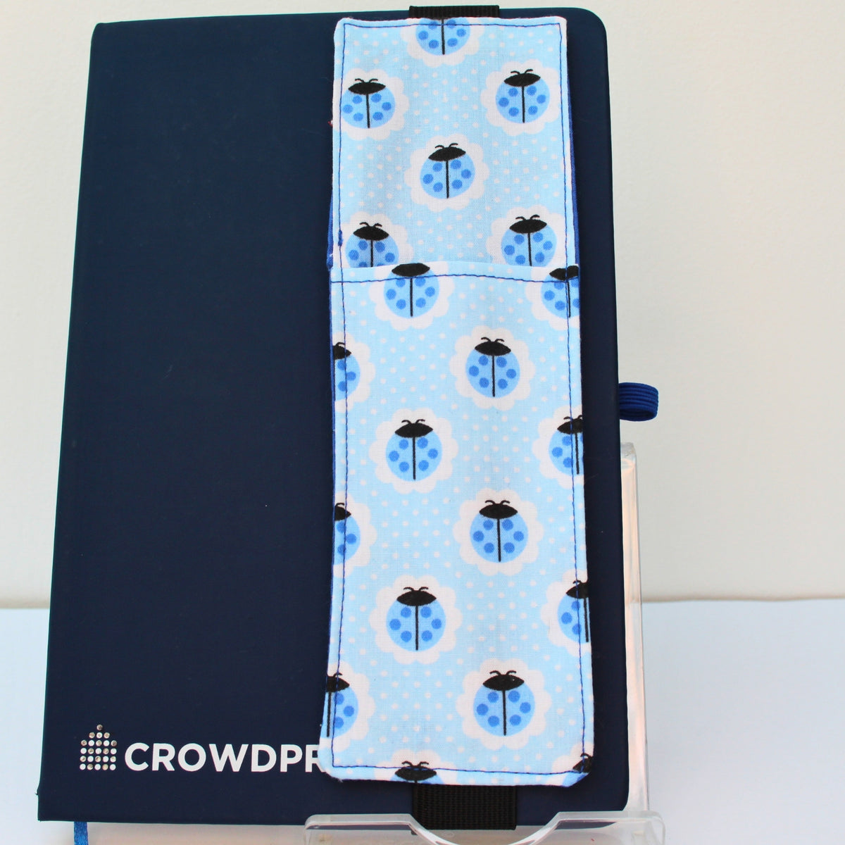Handmade A5 fabric notebook pen pocket in blue ladybird with white dot fabric, black elastic — Dark Star Stitches