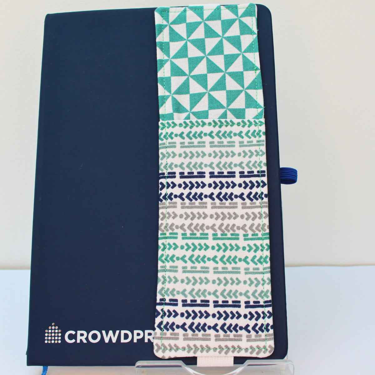 Handmade A5 fabric notebook pen pocket in green/grey arrow and line pattern, white elastic — Dark Star Stitches