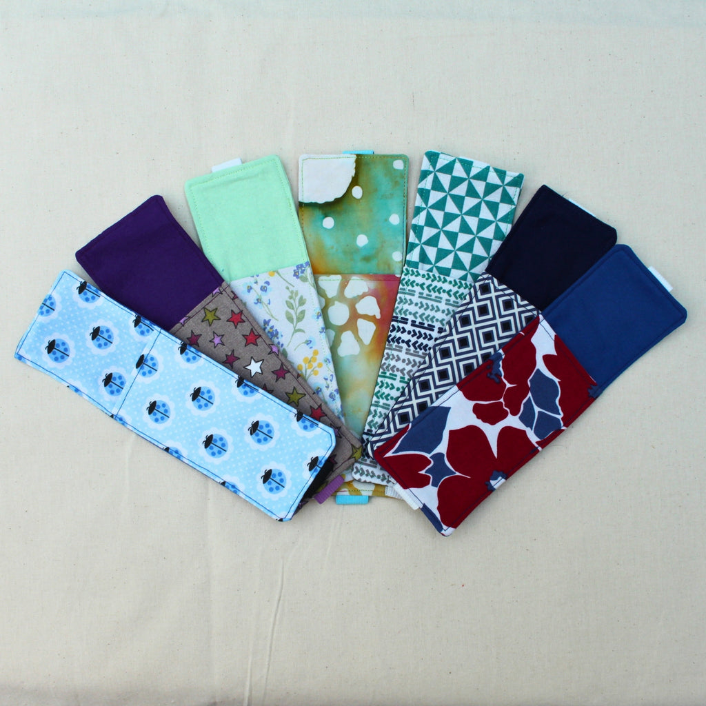 Handmade A5 fabric notebook pen pocket showing range of fabric designs — Dark Star Stitches small batch accessory