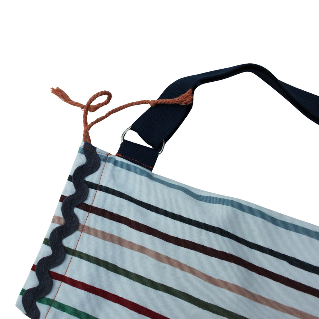 Tie detail on handmade fabric baguette bag in multi-coloured stripes with navy strap — Dark Star Stitches