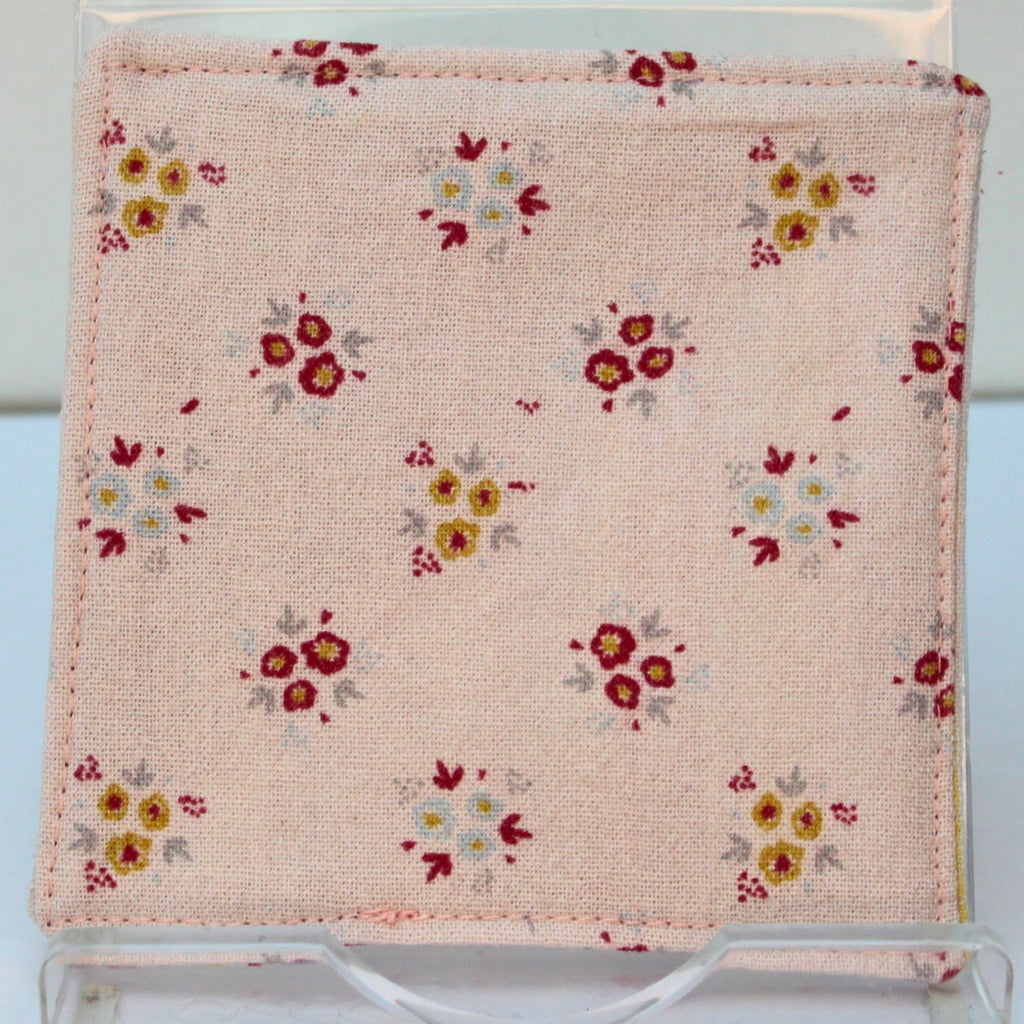 Reverse of handmade fabric bookmark in pale pink floral corner and back with candy stripe inner — Dark Star Stitches