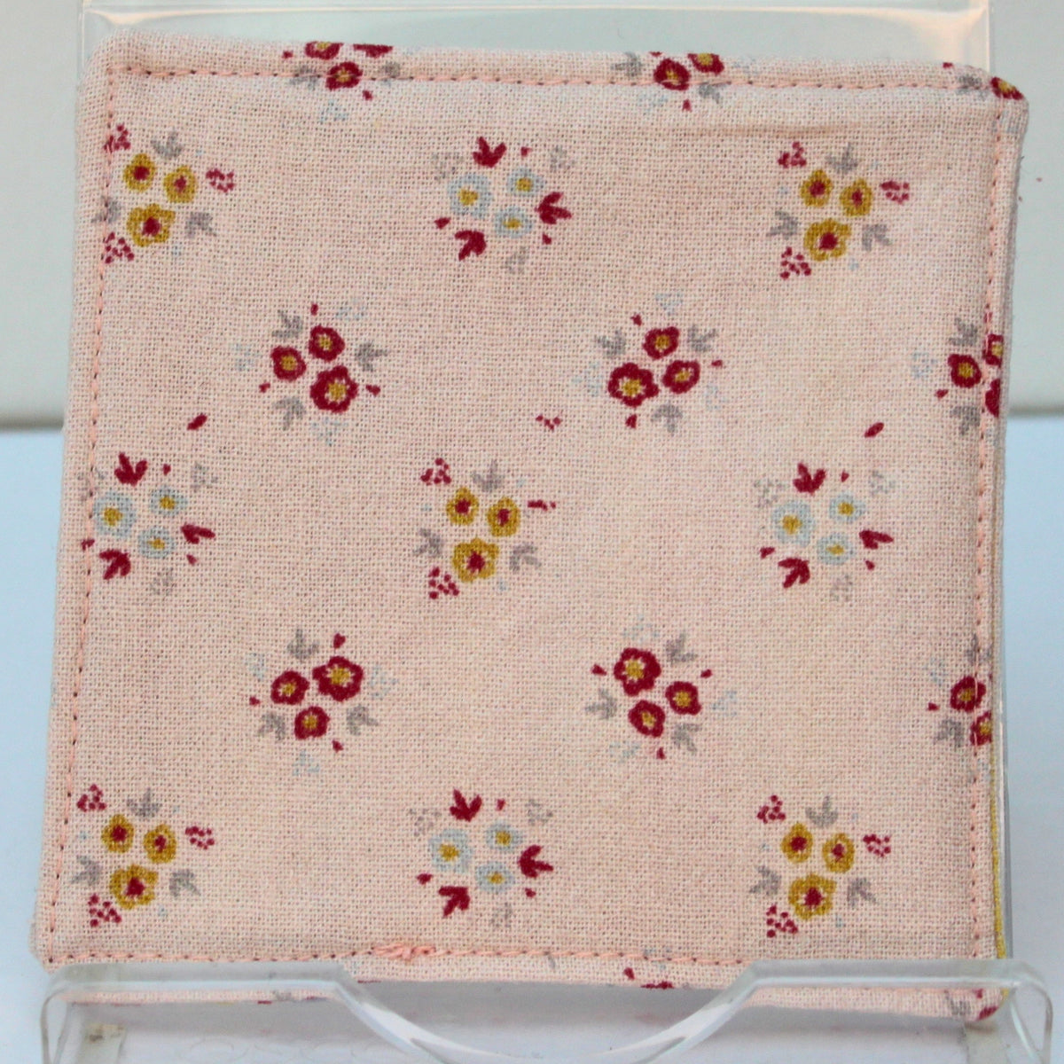 Reverse of handmade fabric bookmark in pale pink floral corner and back with candy stripe inner — Dark Star Stitches