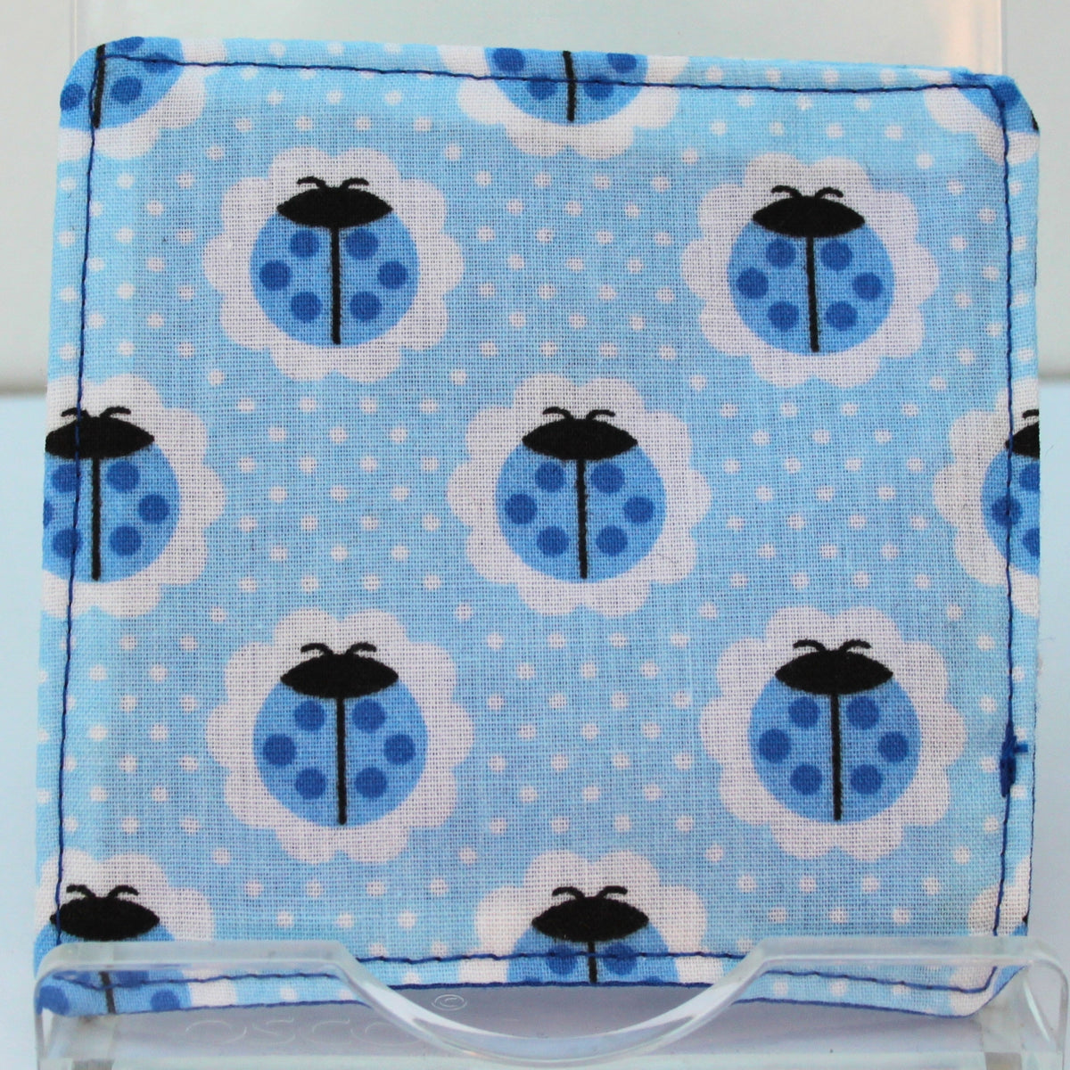 Reverse of handmade fabric bookmark in blue ladybird with white dot corner and back with mid blue inner — Dark Star Stitches
