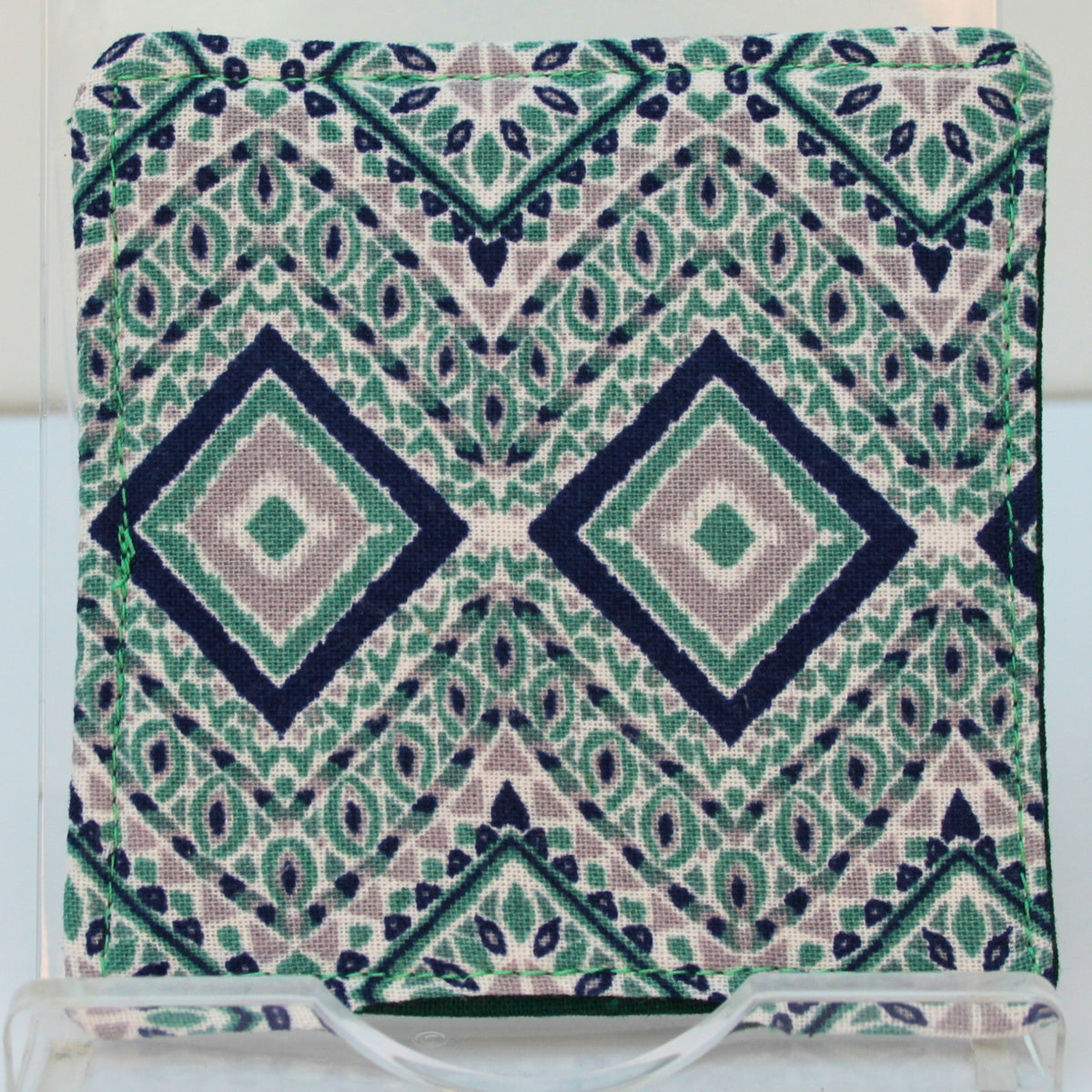 Reverse of handmade fabric bookmark in green/blue/grey diamond pattern corner and back with dark green inner — Dark Star Stitches