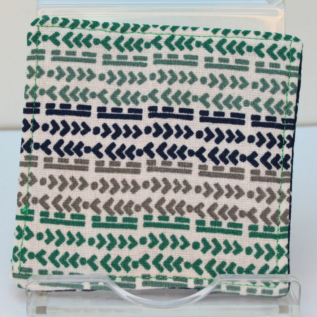 Reverse of handmade fabric bookmark in green/blue/grey arrow and line corner and back with triangles on dark blue inner — Dark Star Stitches