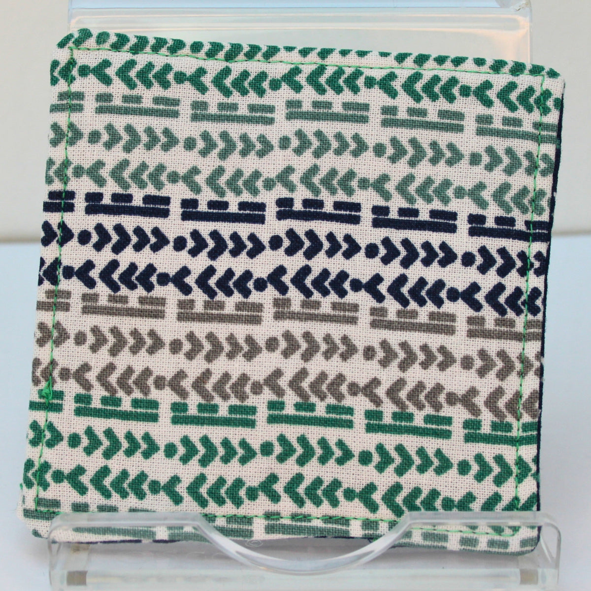 Reverse of handmade fabric bookmark in green/blue/grey arrow and line corner and back with triangles on dark blue inner — Dark Star Stitches