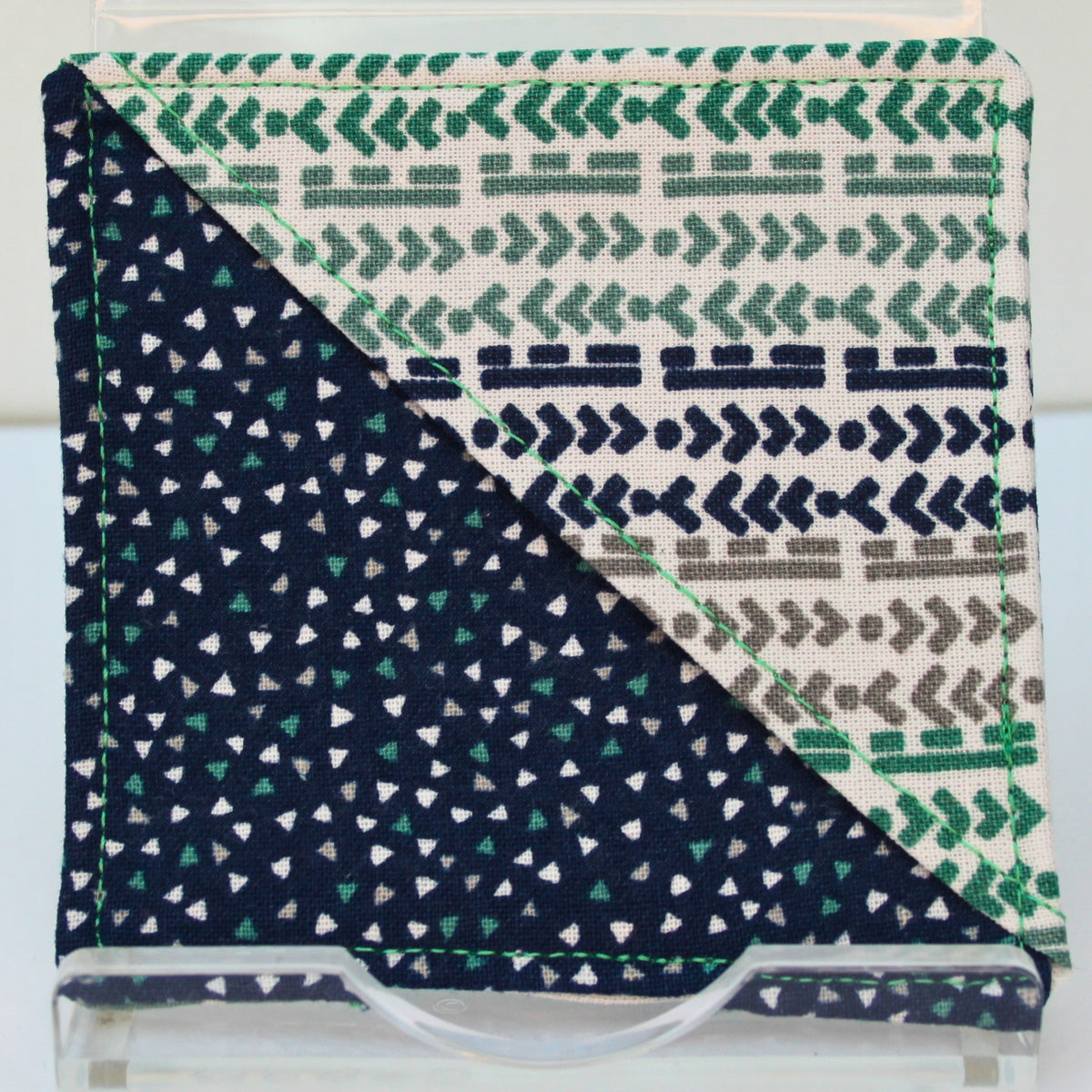 Handmade fabric bookmark in green/blue/grey arrow and line corner and back with triangles on dark blue inner — Dark Star Stitches