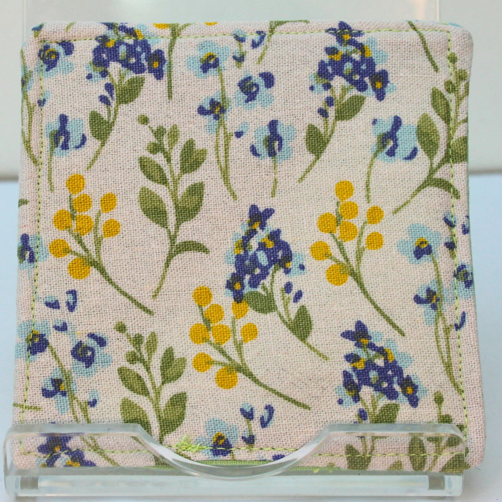 Reverse of handmade fabric bookmark in pale blue and yellow florals on white corner and back with pale green inner — Dark Star Stitches
