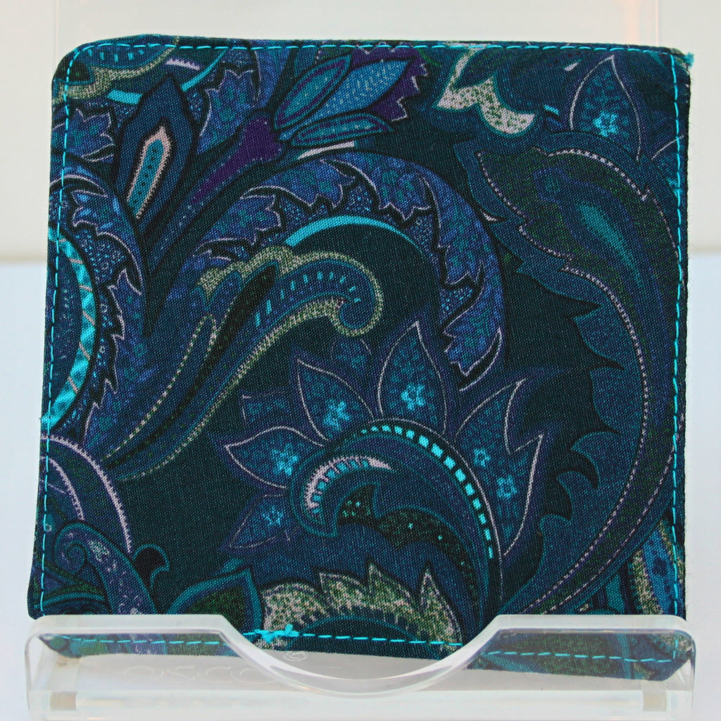 Reverse of handmade fabric bookmark in electric blue and pink paisley on green corner and back with dark green inner — Dark Star Stitches
