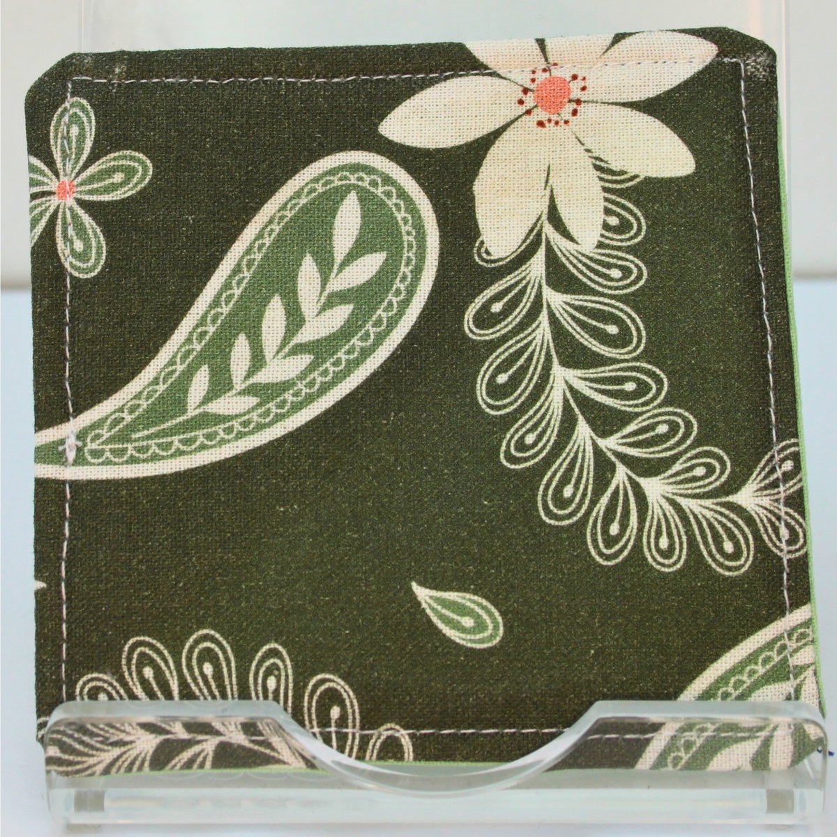 Reverse of handmade fabric bookmark in white floral on dark green corner and back with pale green inner — Dark Star Stitches