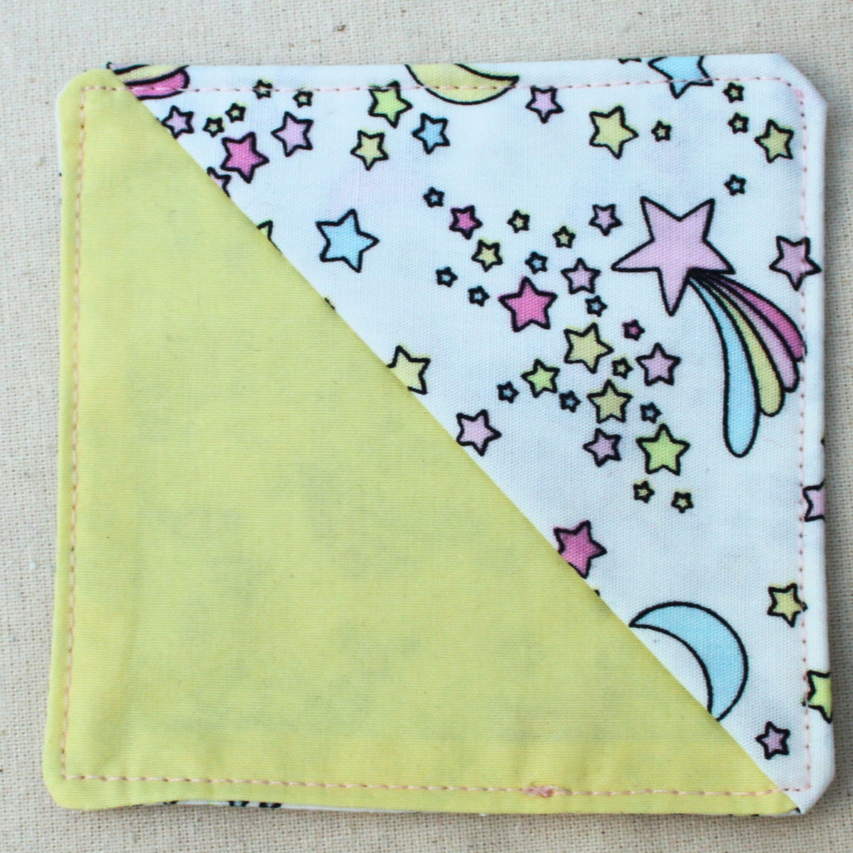 Handmade fabric bookmark in pastel moons and stars cotton — part of booksleeve set by Dark Star Stitches