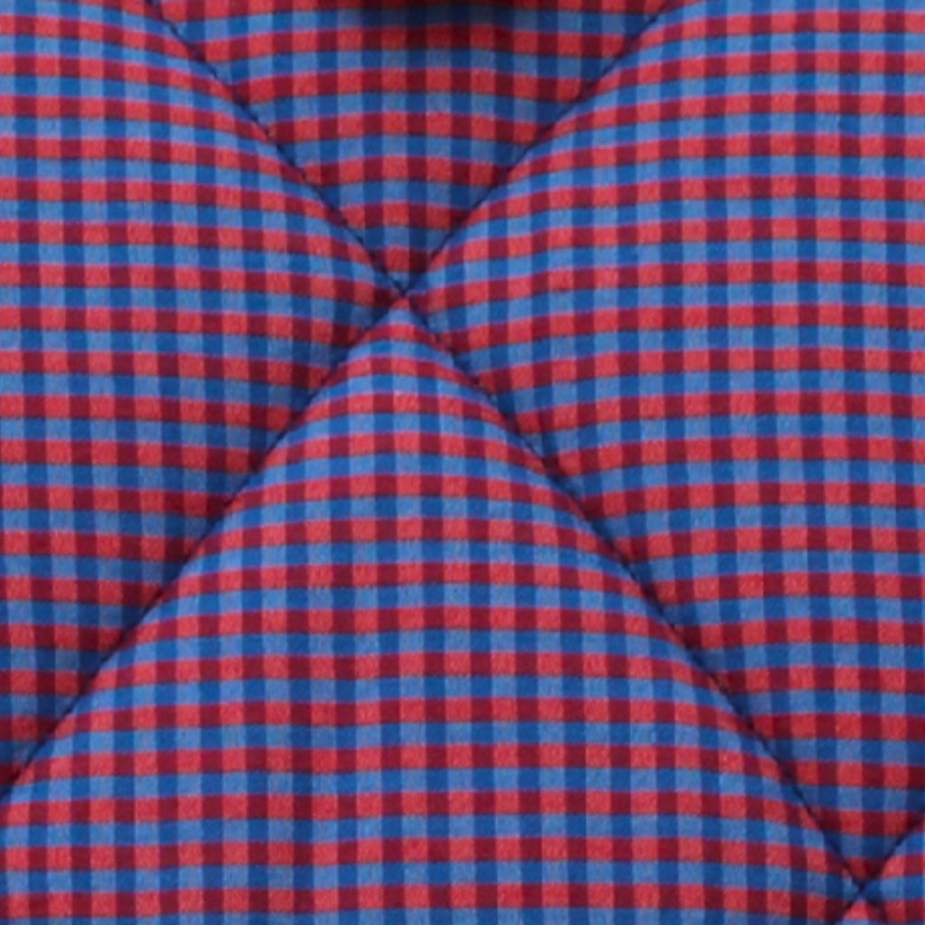 Close-up of red and blue check pattern on cotton fabric used in handmade quilted booksleeve set — Dark Star Stitches