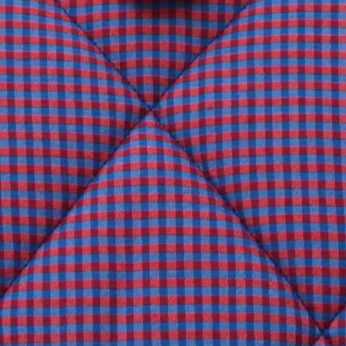 Close-up of red and blue check pattern on cotton fabric used in handmade quilted booksleeve set — Dark Star Stitches