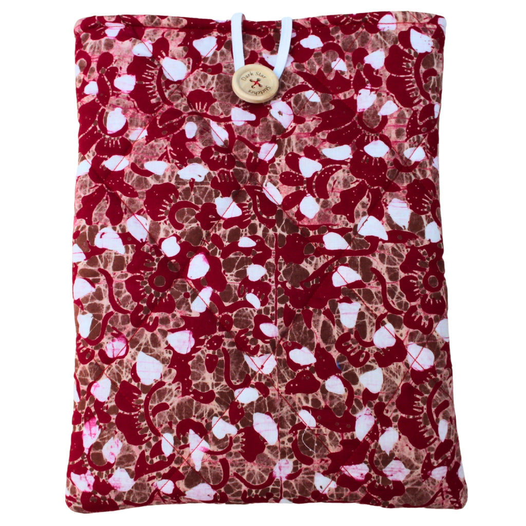 Quilted handmade booksleeve in red, brown and white patterned cotton with front pocket — Dark Star Stitches