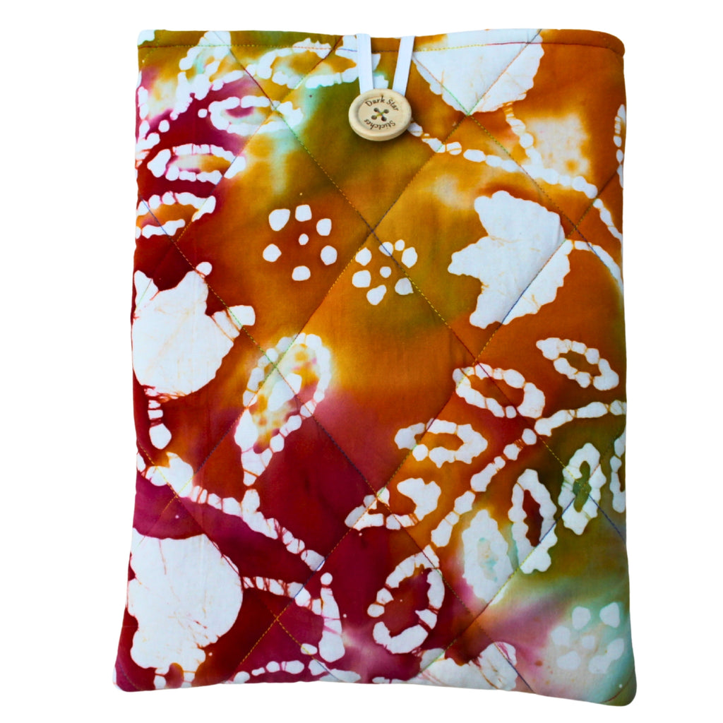 Quilted handmade booksleeve in tie dye patterned fabric with front pocket — Dark Star Stitches