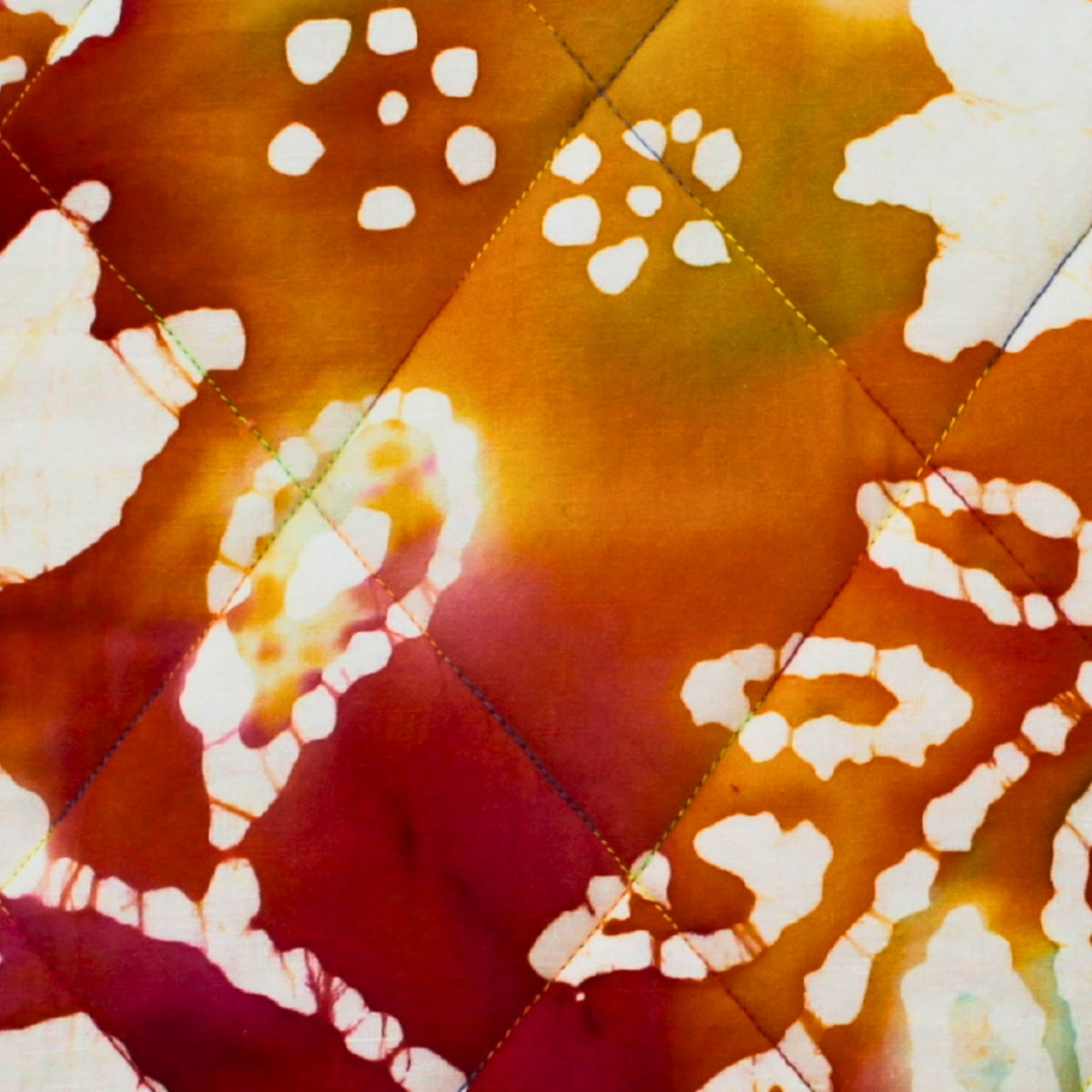 Close-up of tie dye pattern on cotton fabric used in handmade quilted booksleeve set — Dark Star Stitches