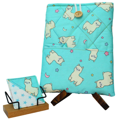 Handmade booksleeve set with cartoon alpacas on bright blue cotton fabric, including quilted booksleeve and fabric bookmark