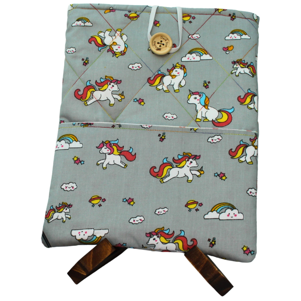 Quilted handmade booksleeve in cartoon unicorn grey fabric with pink star lining and front pocket