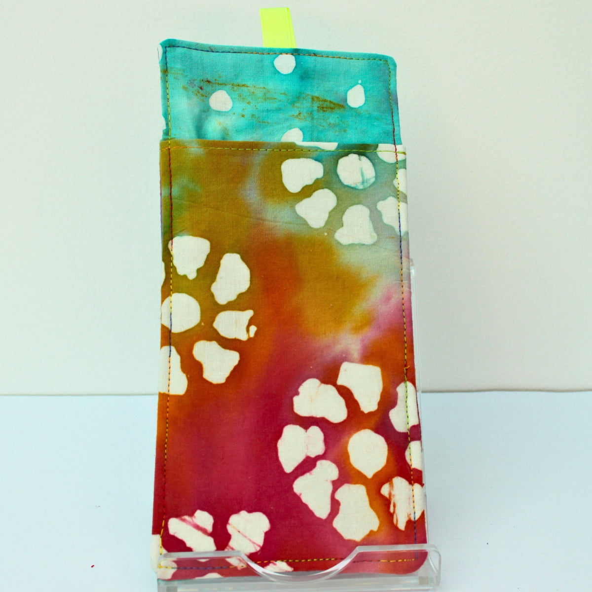Reverse of handmade double sided lanyard pocket in tie dye with patterns fabric, hi vis green ribbon — Dark Star Stitches
