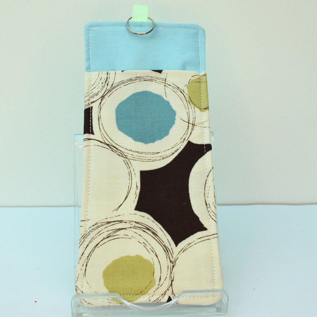 Handmade double sided lanyard pocket in black circles and splodges on brown fabric, pale green ribbon — Dark Star Stitches