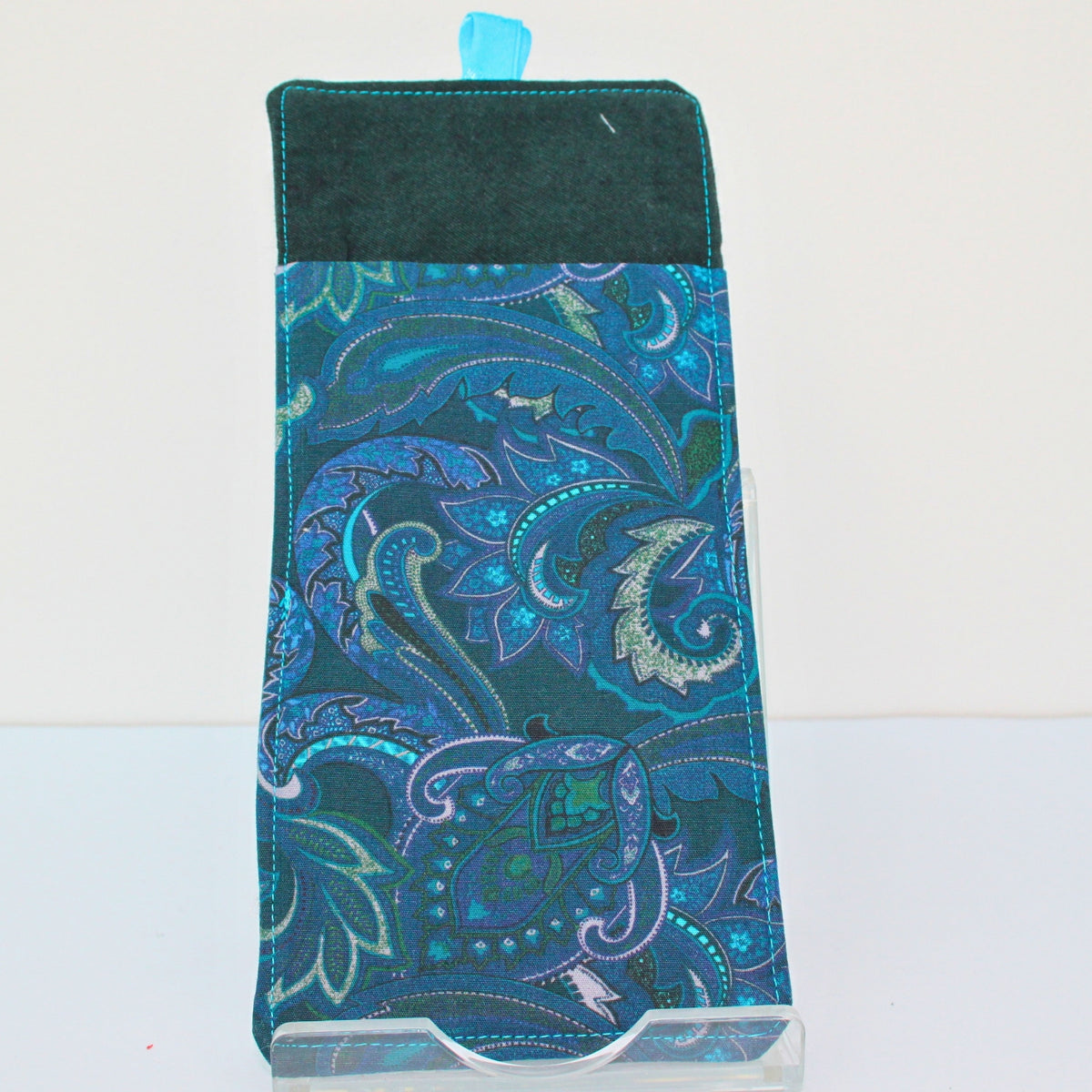Reverse of handmade double sided lanyard pocket in electric blue and pink paisley with dark green inners, electric blue ribbon — Dark Star Stitches
