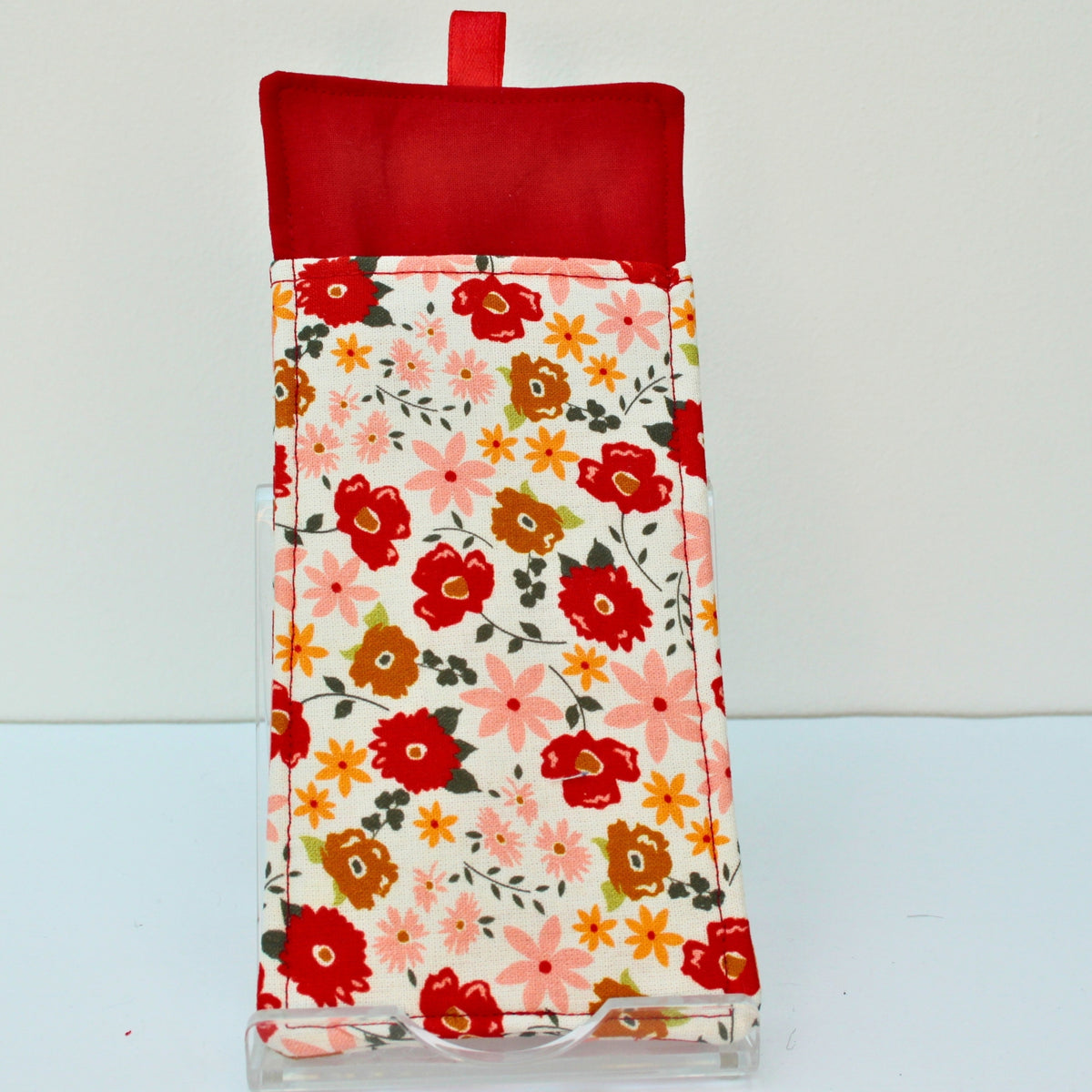 Reverse of handmade double sided lanyard pocket in multi-coloured floral on white fabric, red ribbon — Dark Star Stitches