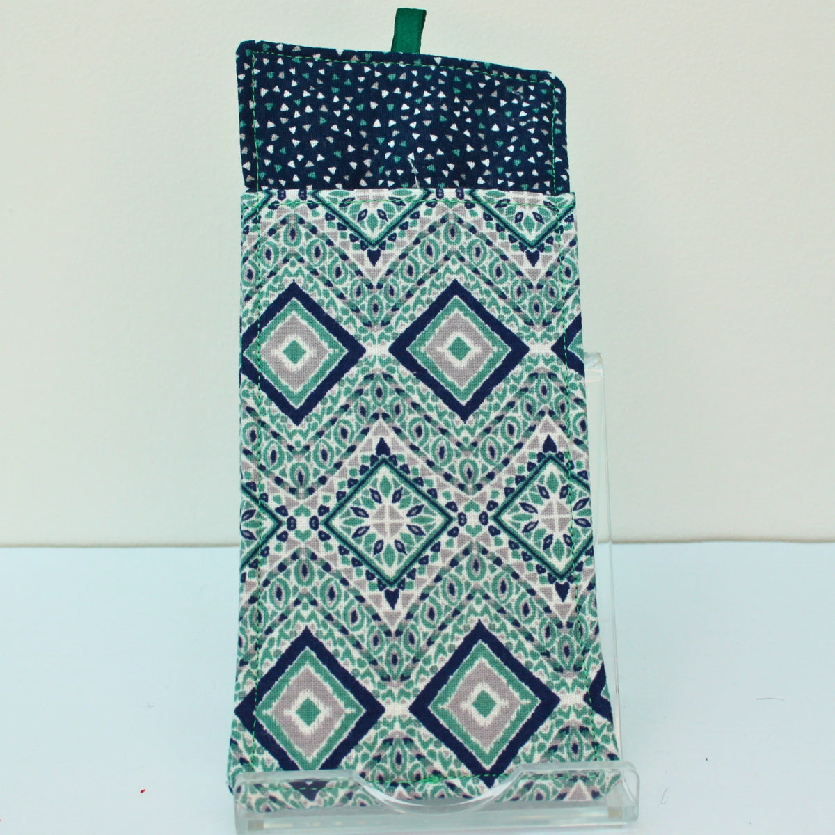 Reverse of handmade double sided lanyard pocket in green/blue/grey diamond and triangle pattern, dark blue inners — Dark Star Stitches