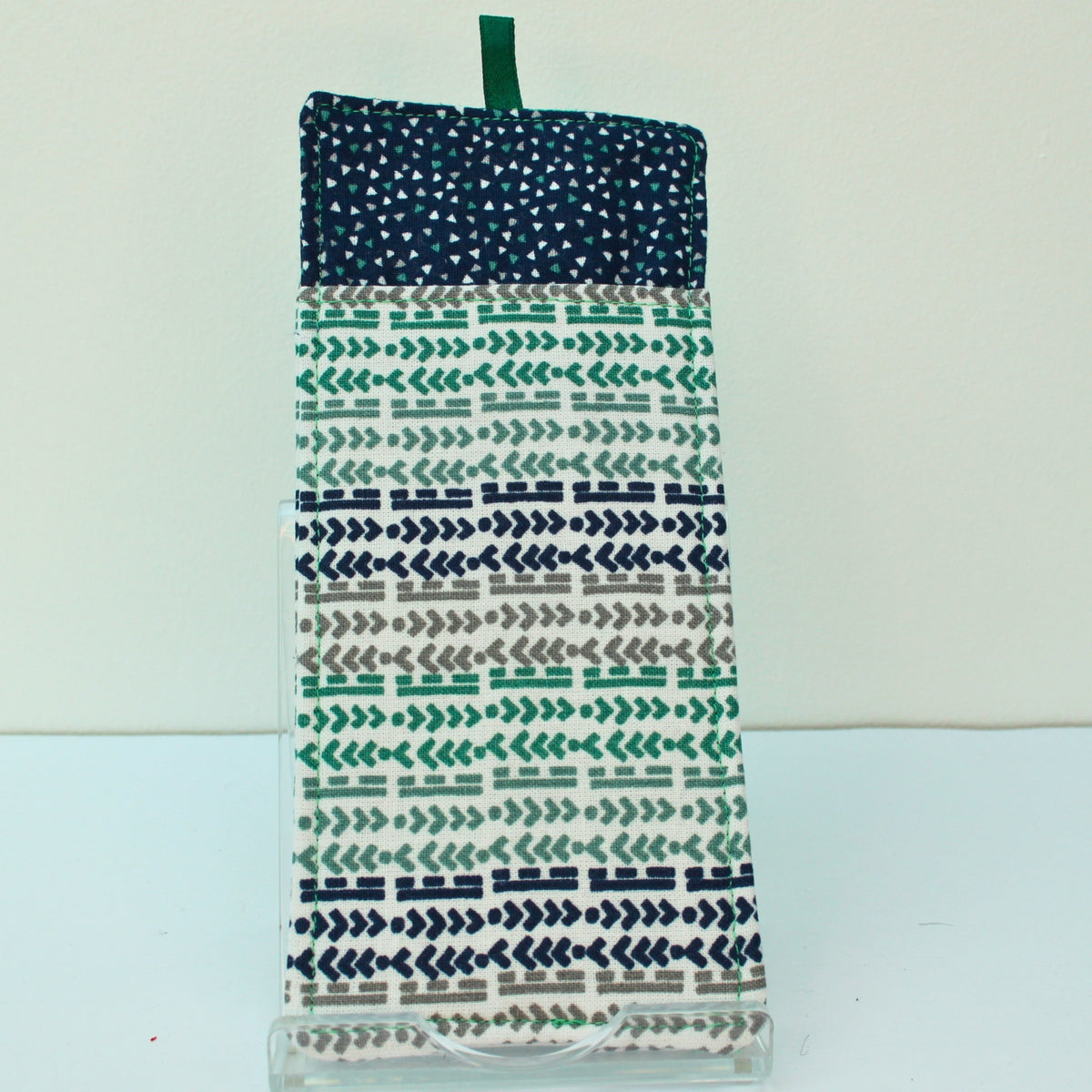 Reverse of handmade double sided lanyard pocket in green/blue/grey arrow and line pattern, dark blue inners — Dark Star Stitches