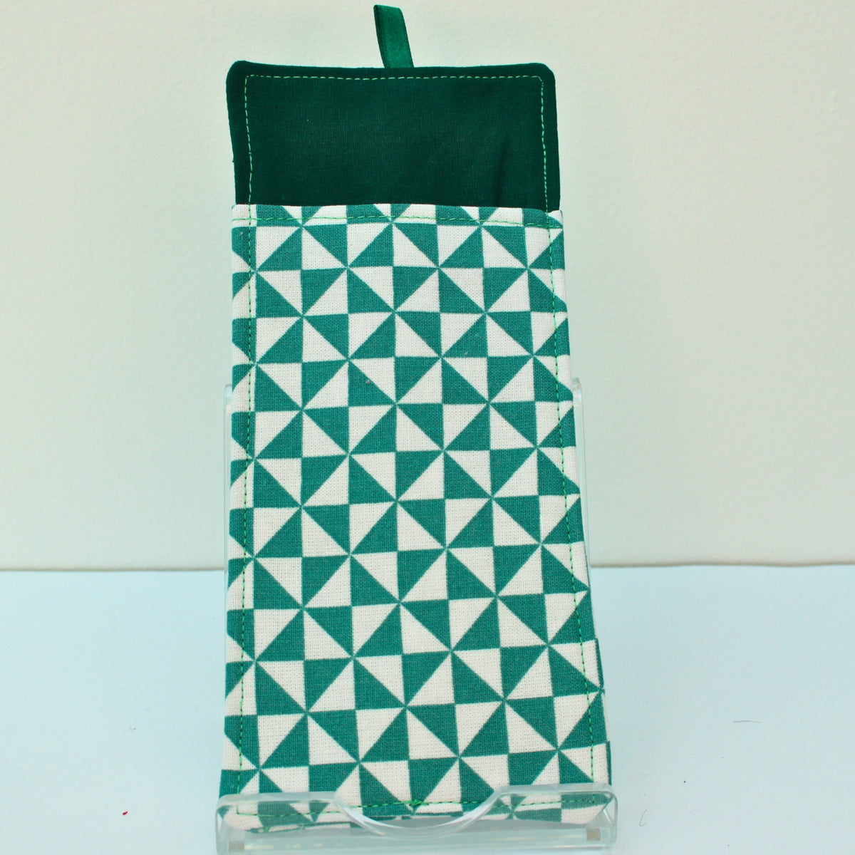 Reverse of handmade double sided lanyard pocket in green and white triangles fabric, dark green ribbon — Dark Star Stitches