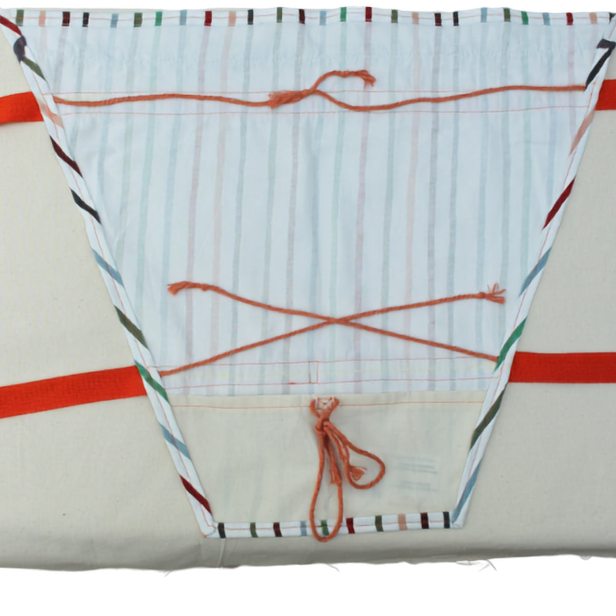 Inner lining of handmade fabric bouquet bag in multi-coloured stripes with fixed orange strap — Dark Star Stitches