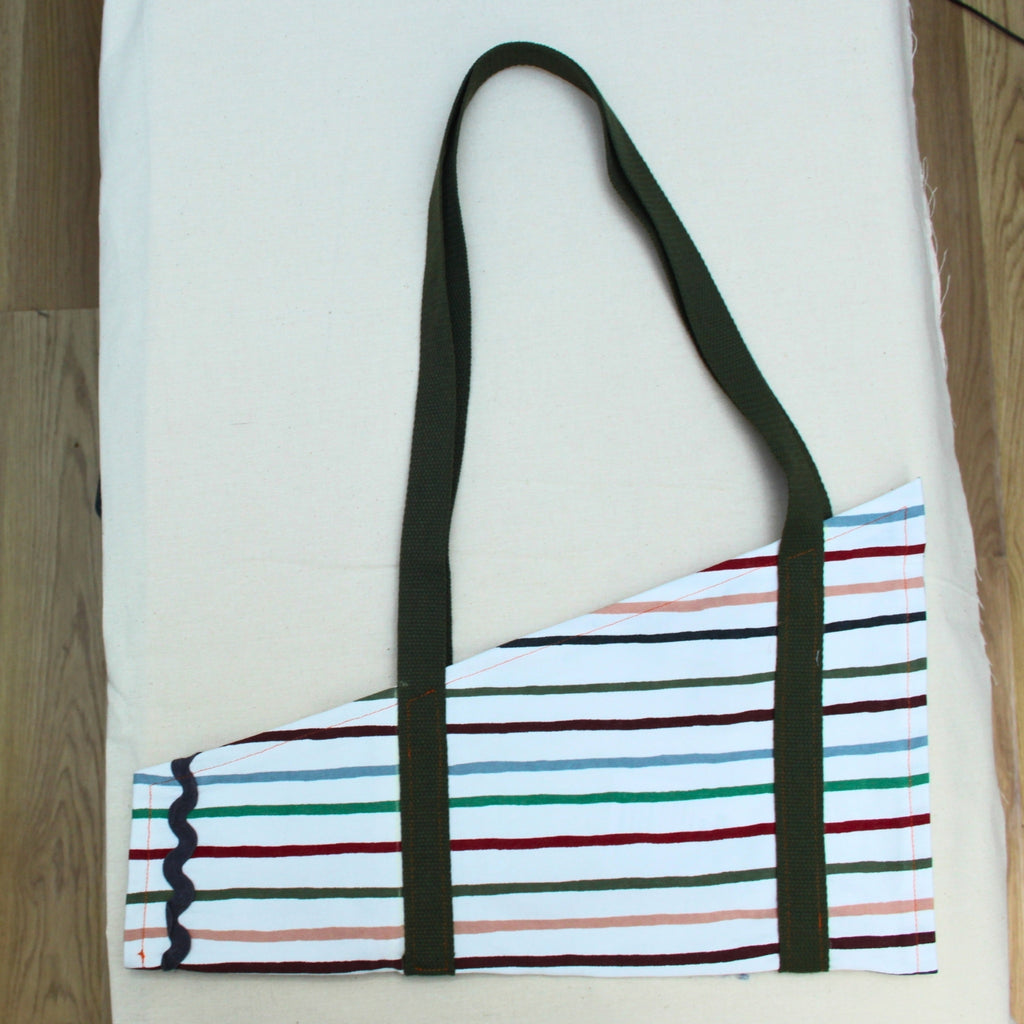 Handmade fabric bouquet bag in multi-coloured stripes with fixed khaki strap — Dark Star Stitches