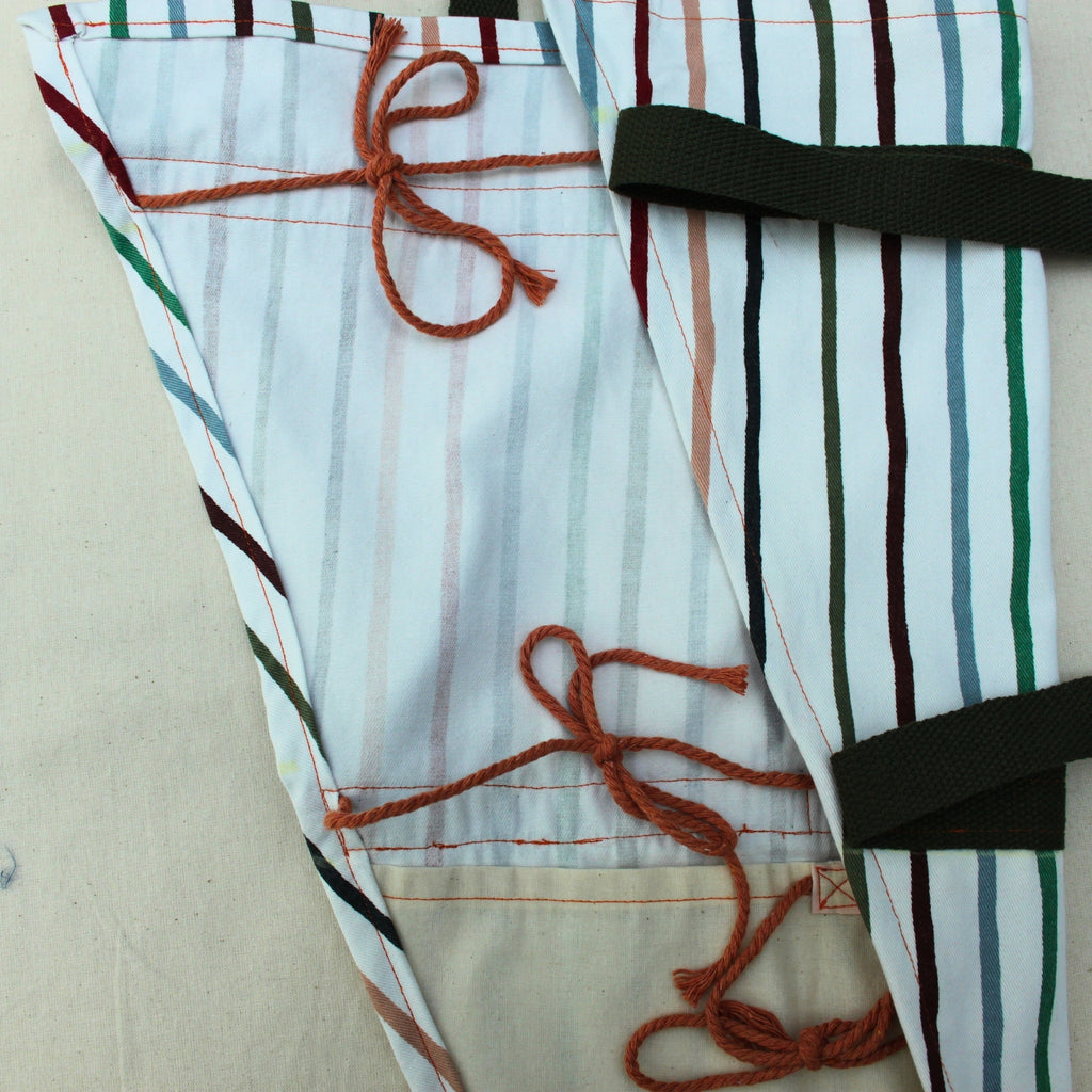 Tie detail on handmade fabric bouquet bag in multi-coloured stripes with fixed khaki strap — Dark Star Stitches