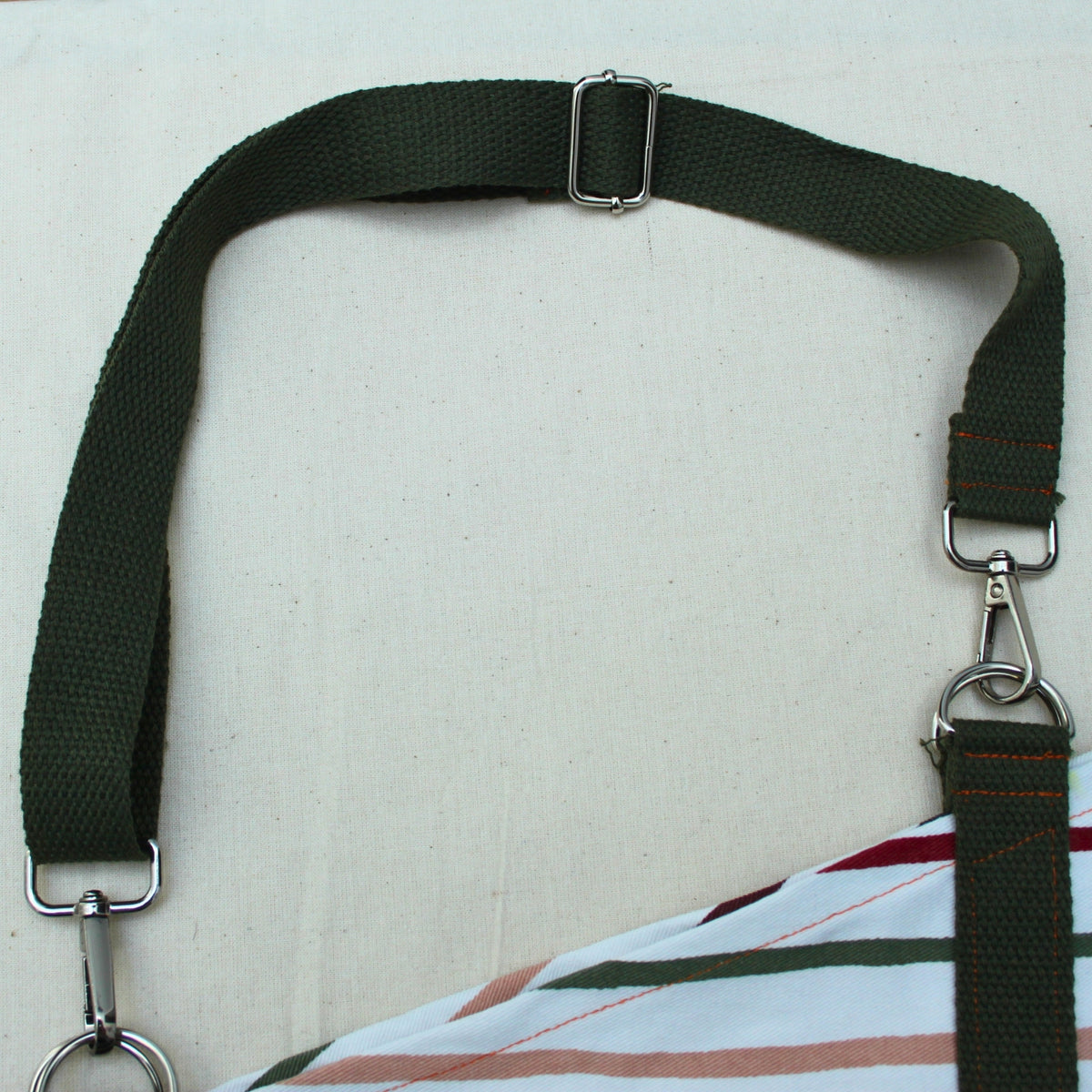 Adjustable khaki strap detail on handmade fabric bouquet bag in multi-coloured stripes — Dark Star Stitches