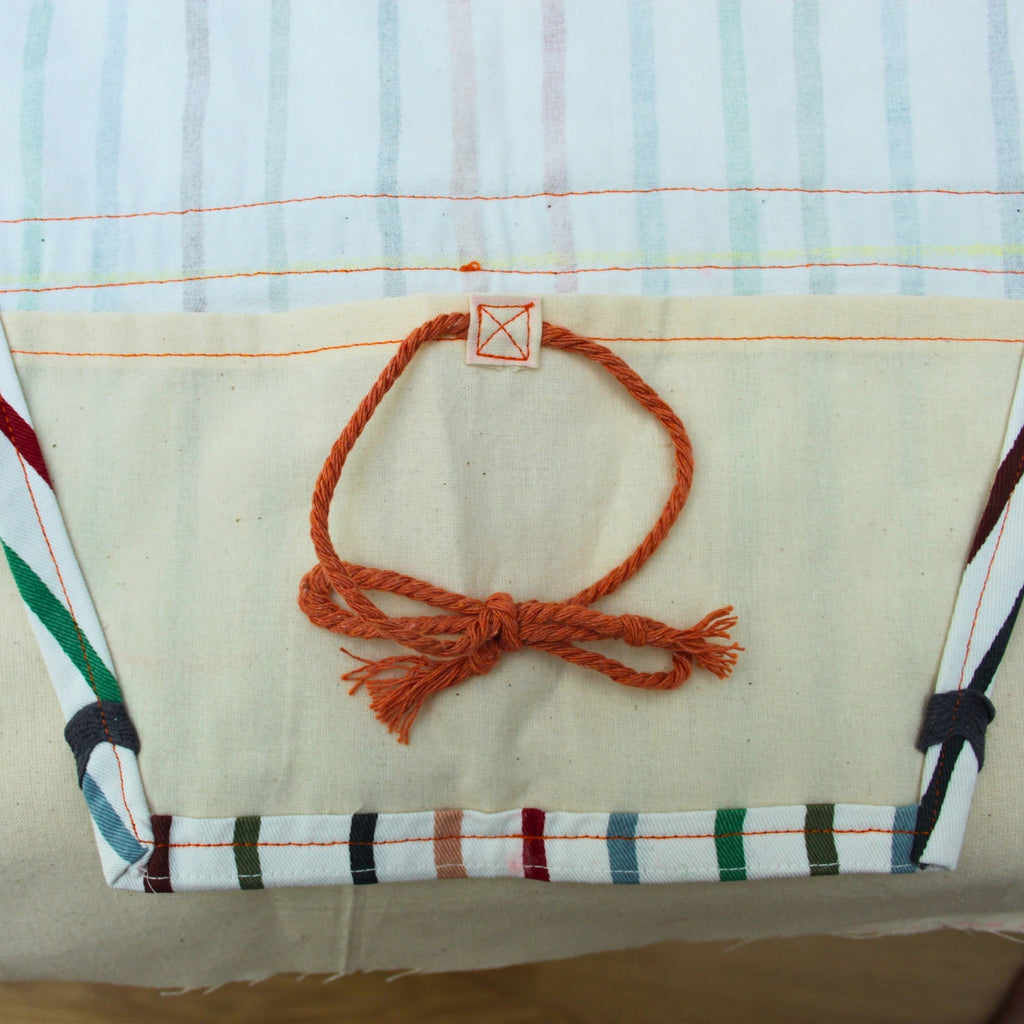 Pocket and tie detail on handmade fabric bouquet bag in multi-coloured stripes — Dark Star Stitches