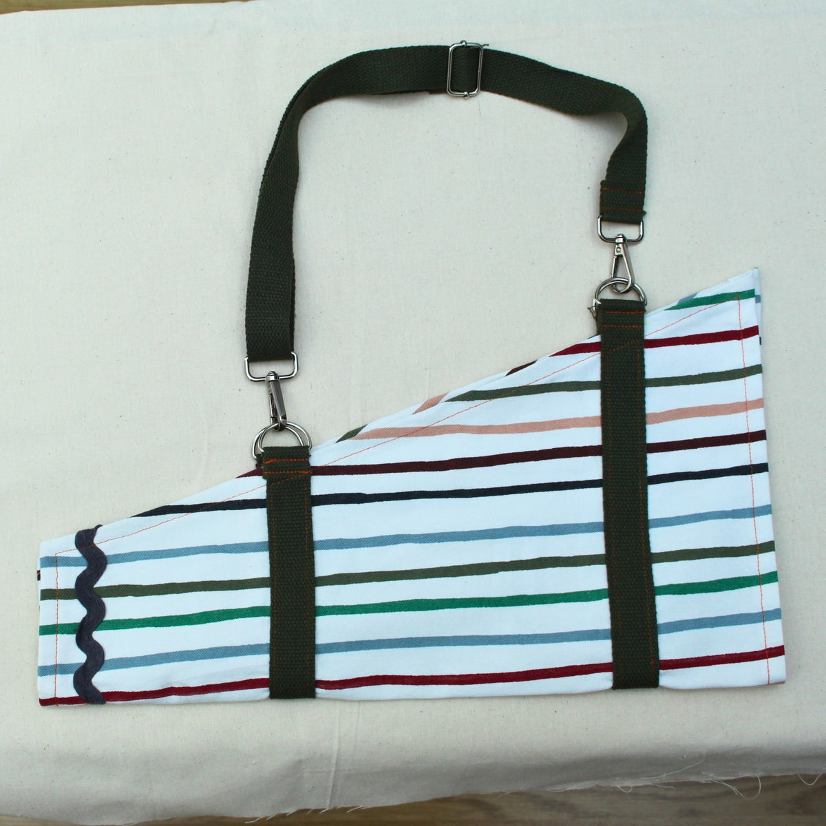 Handmade fabric bouquet bag in multi-coloured stripes with adjustable khaki strap — Dark Star Stitches